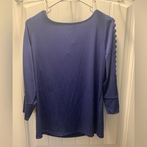 Large indigo top. 3/4th length sleeves are open and have “gold” accents. NWT